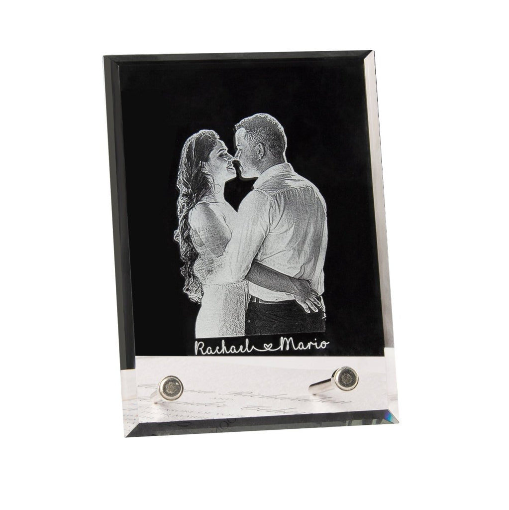 Glass photo frame with a black and white illustration of a couple, engraved with 'Rachael & Mario'.
