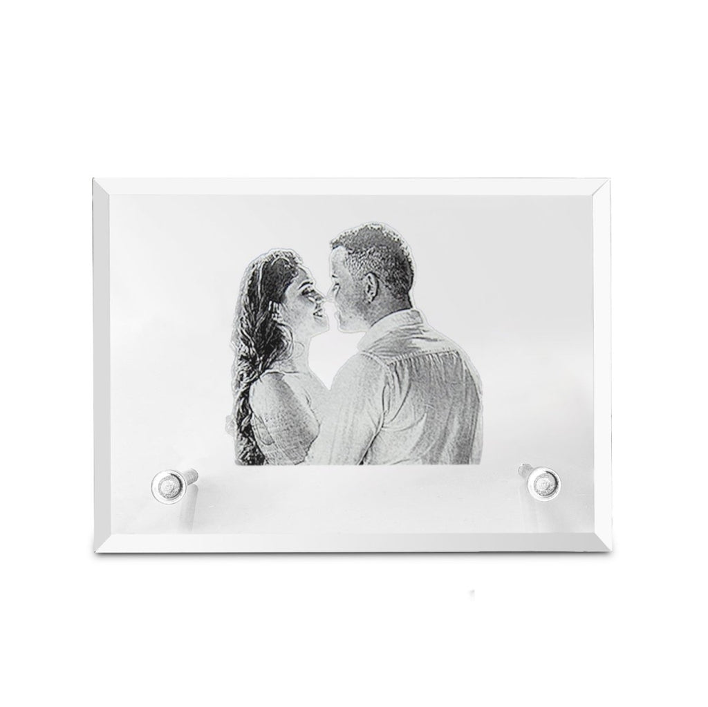 Framed black and white photo of a couple embracing on a white background