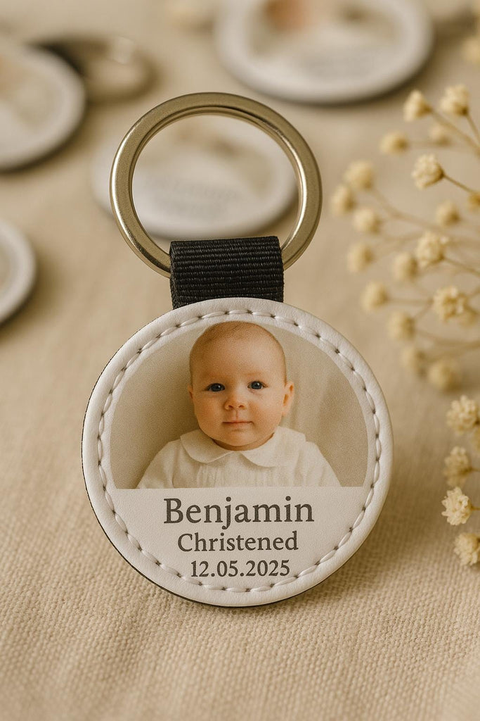 a key chain with a picture of a baby on it