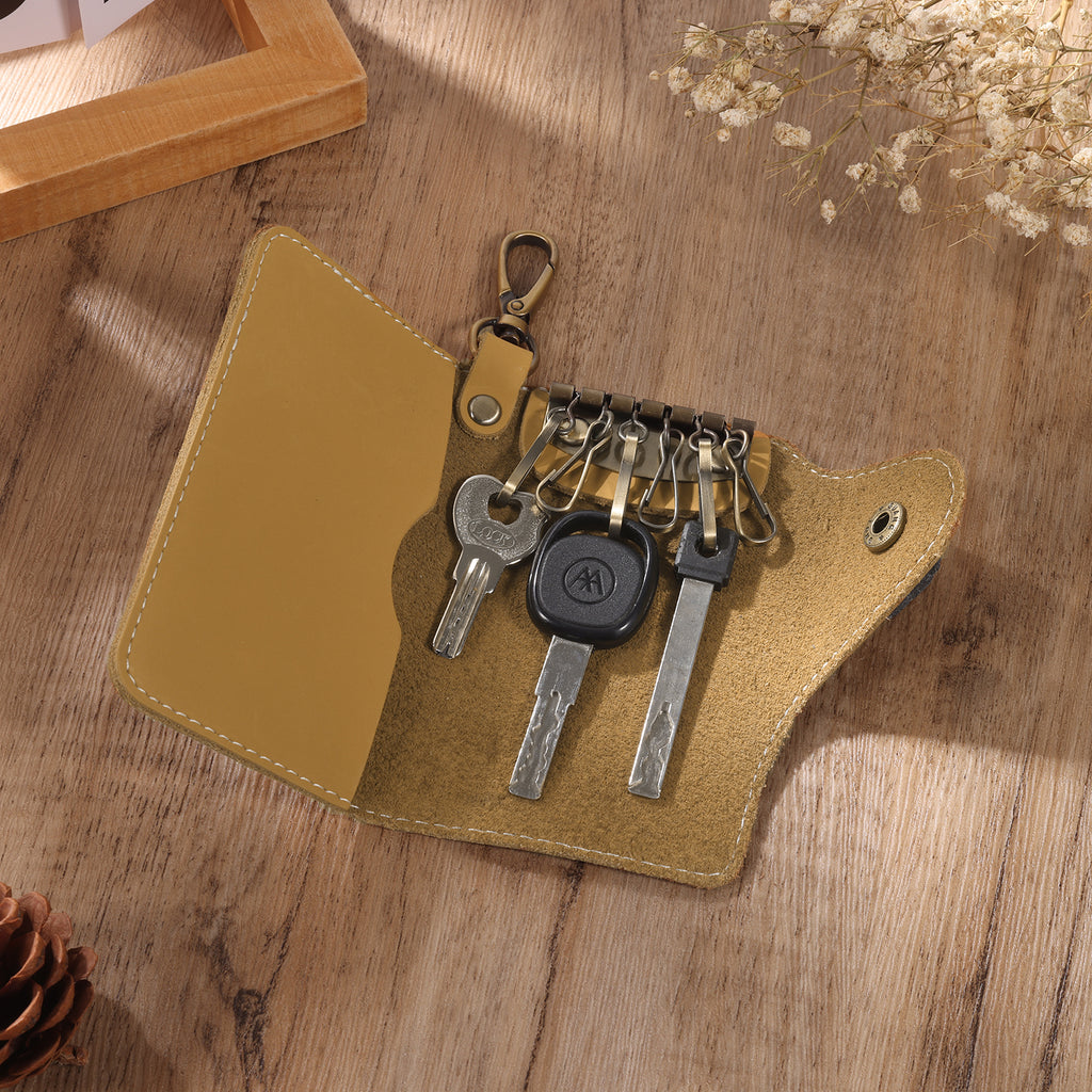 Personalised leather key holder (11.5cm x 7.2cm) with engraved initial and custom line art from your photo.