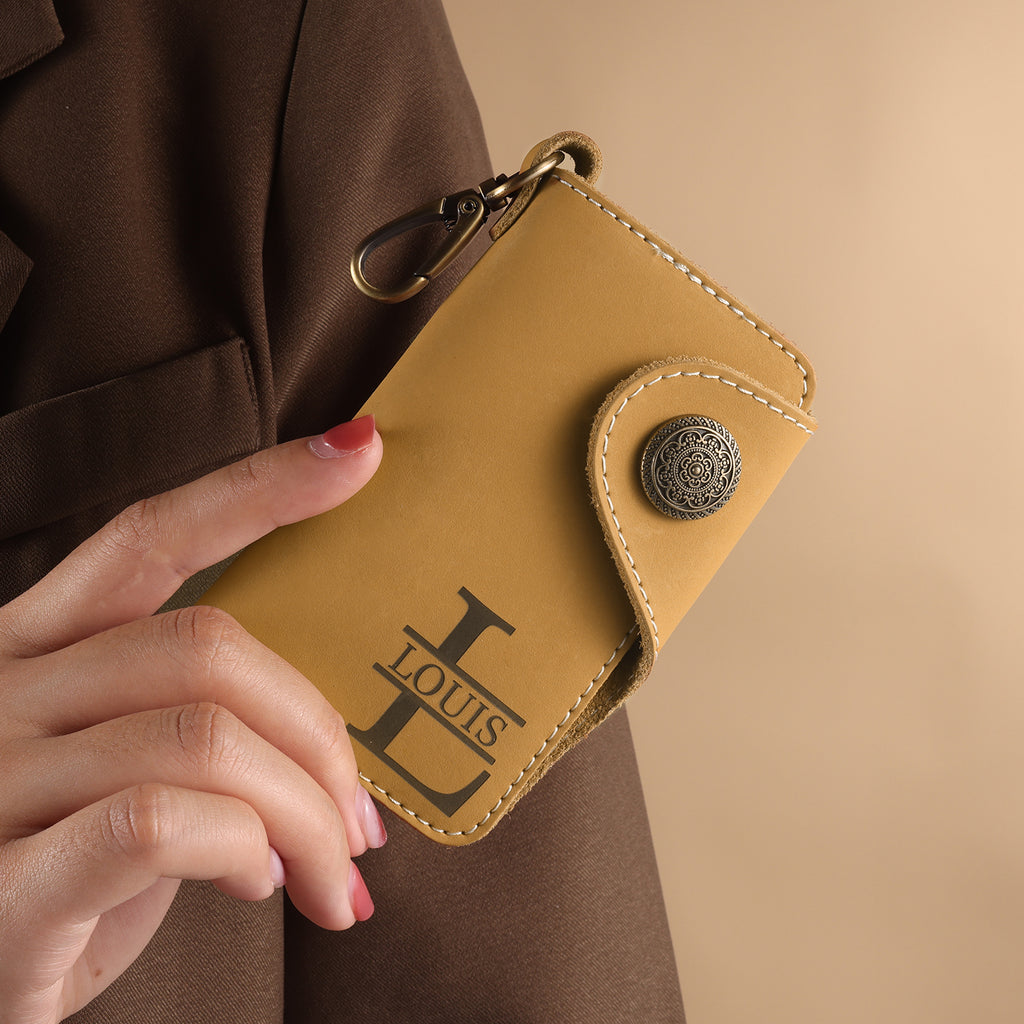 Personalised leather key holder (11.5cm x 7.2cm) with engraved initial and custom line art from your photo.