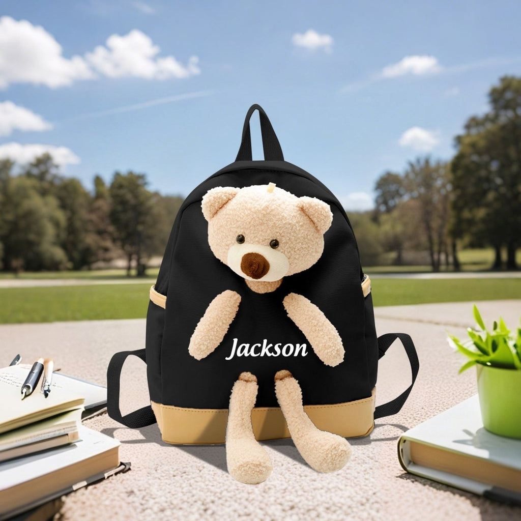 Black backpack with plush bear and custom name