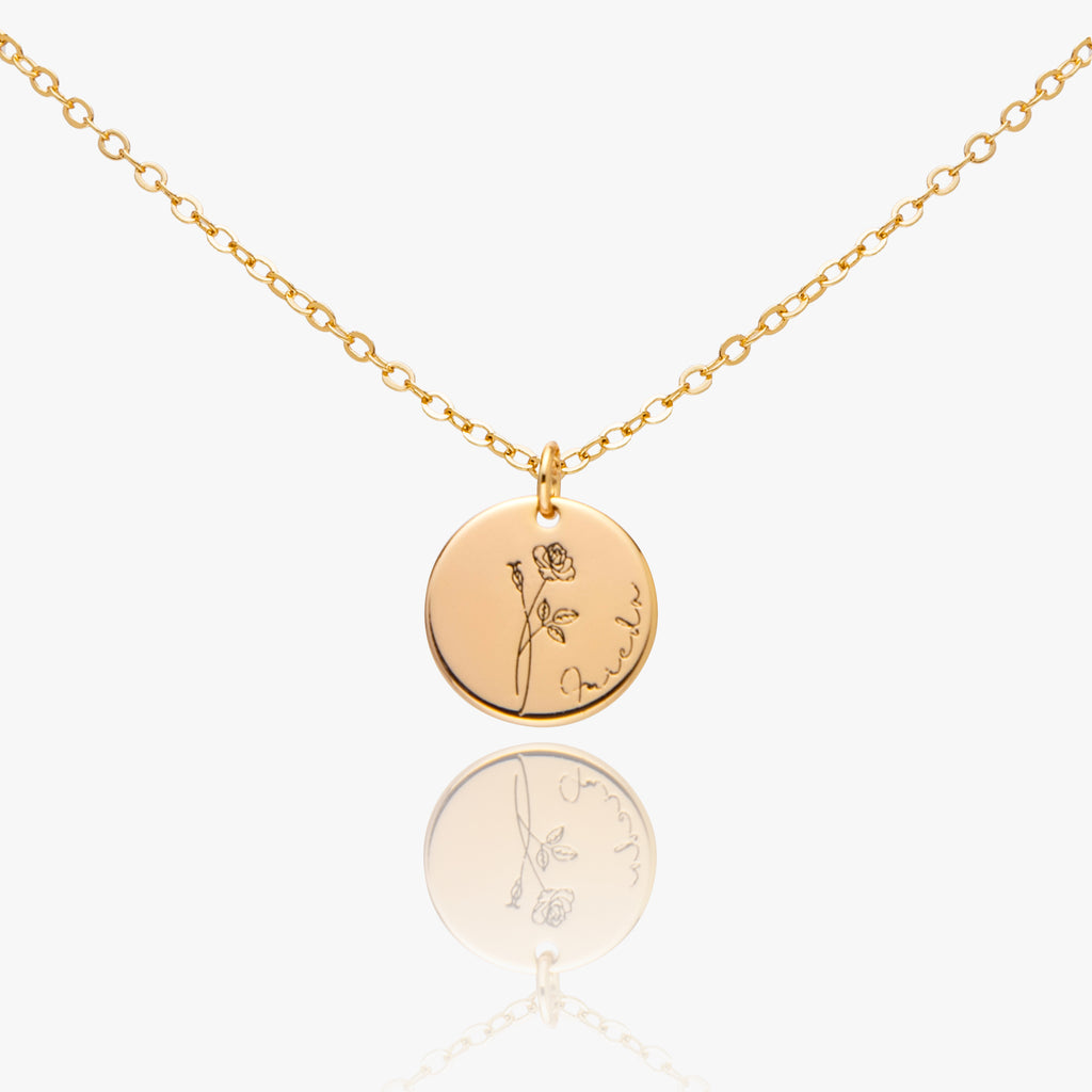 Gold necklace with engraved pendants on a white background