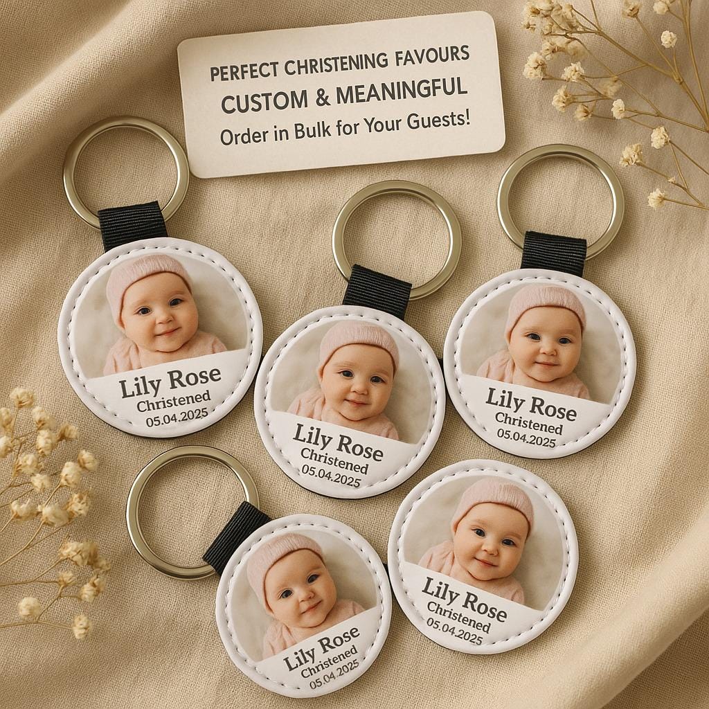 a set of four key chains with a picture of a baby