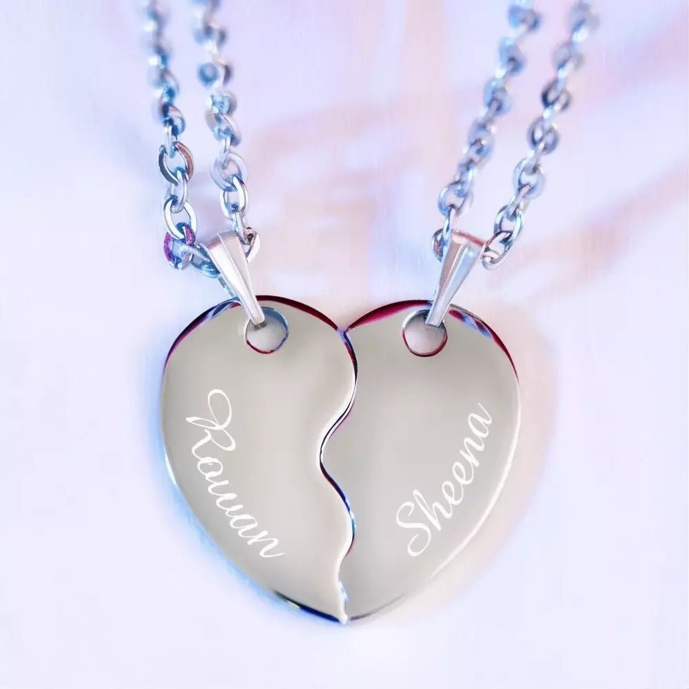 Personalized stainless steel split heart pendant necklace, 22-inch curb chain, engraved with names.