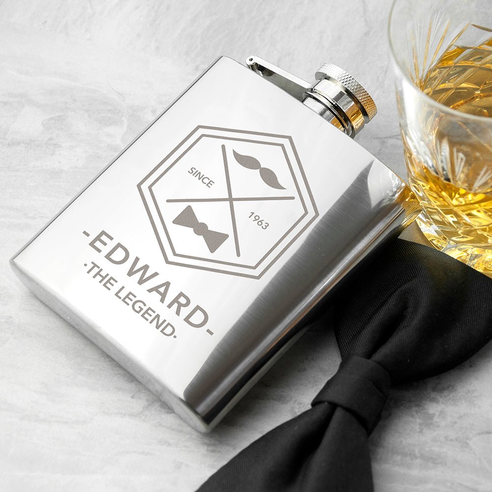 Personalized silver hip flask with engraved name and year, moustache design, stainless steel.