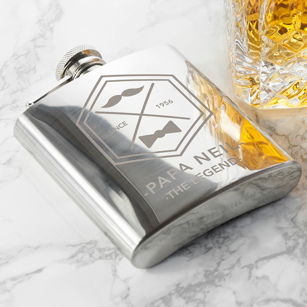 Personalized silver hip flask with engraved name and year, moustache design, stainless steel.
