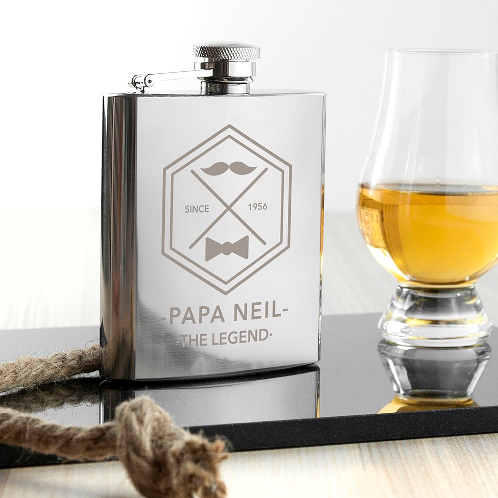 Personalized silver hip flask with engraved name and year, moustache design, stainless steel.
