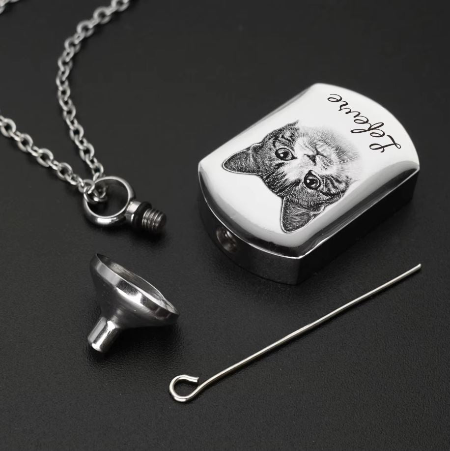 Keep your pet’s memory close with this personalised urn necklace, holding ashes and a cherished photo.