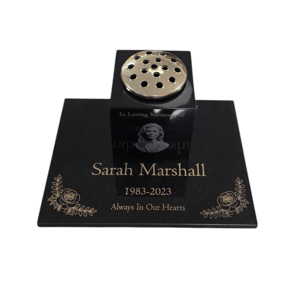 Memorial urn with engraved text on a white background