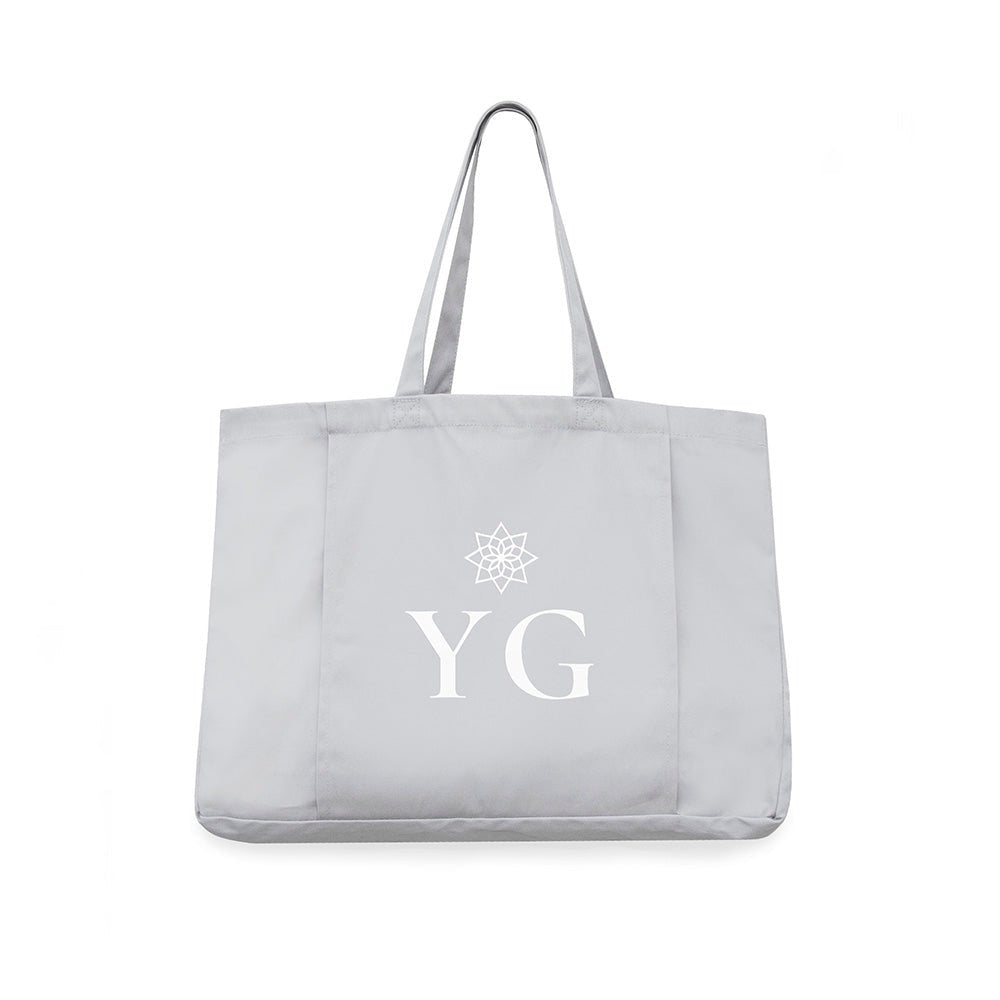 Gray tote bag with 'YG' initials and a logo on a white background