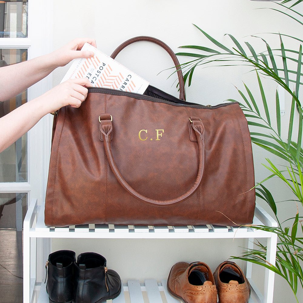Monogrammed vegan leather travel suit bag, 37L, black or brown, personalized with up to 3 initials.