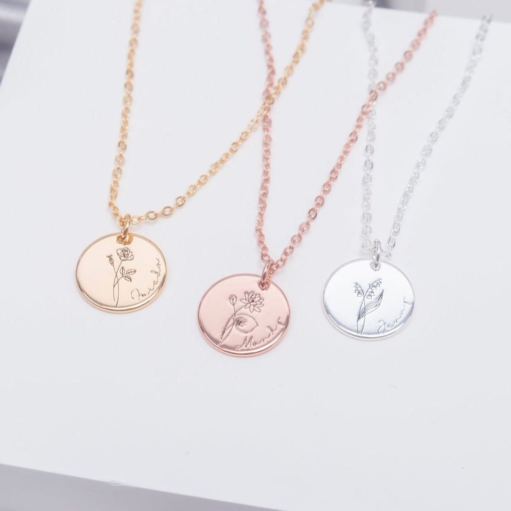 Three necklaces with circular pendants on a light background engraved memories