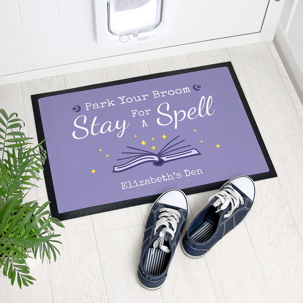 Personalized Halloween doormat with spell book design, 40x60cm, rubber, custom name, spooky decor.