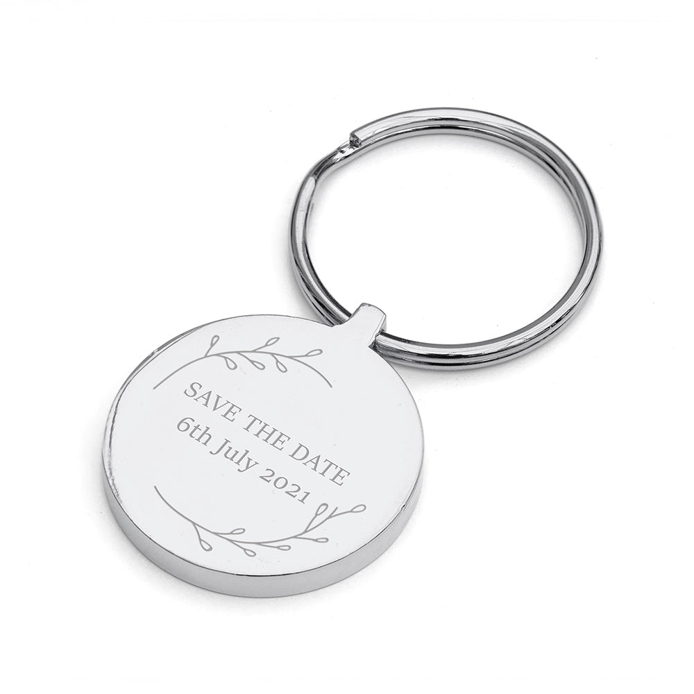 Silver keychain with 'Save the Date' engraving on a white background