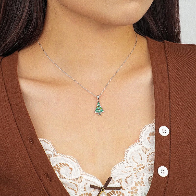 Festive sterling silver Christmas tree necklace with sparkling CZ stones—perfect for adding holiday charm.