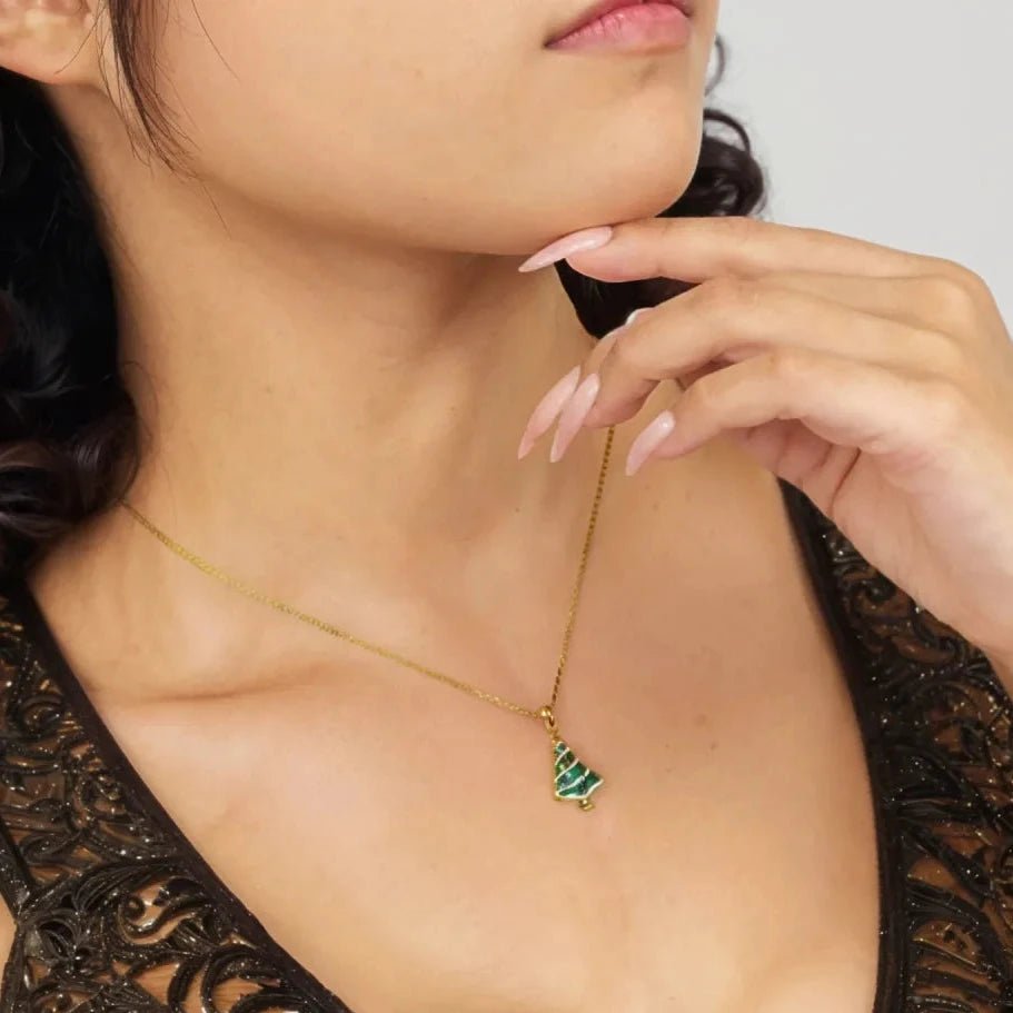 Festive sterling silver Christmas tree necklace with sparkling CZ stones—perfect for adding holiday charm.