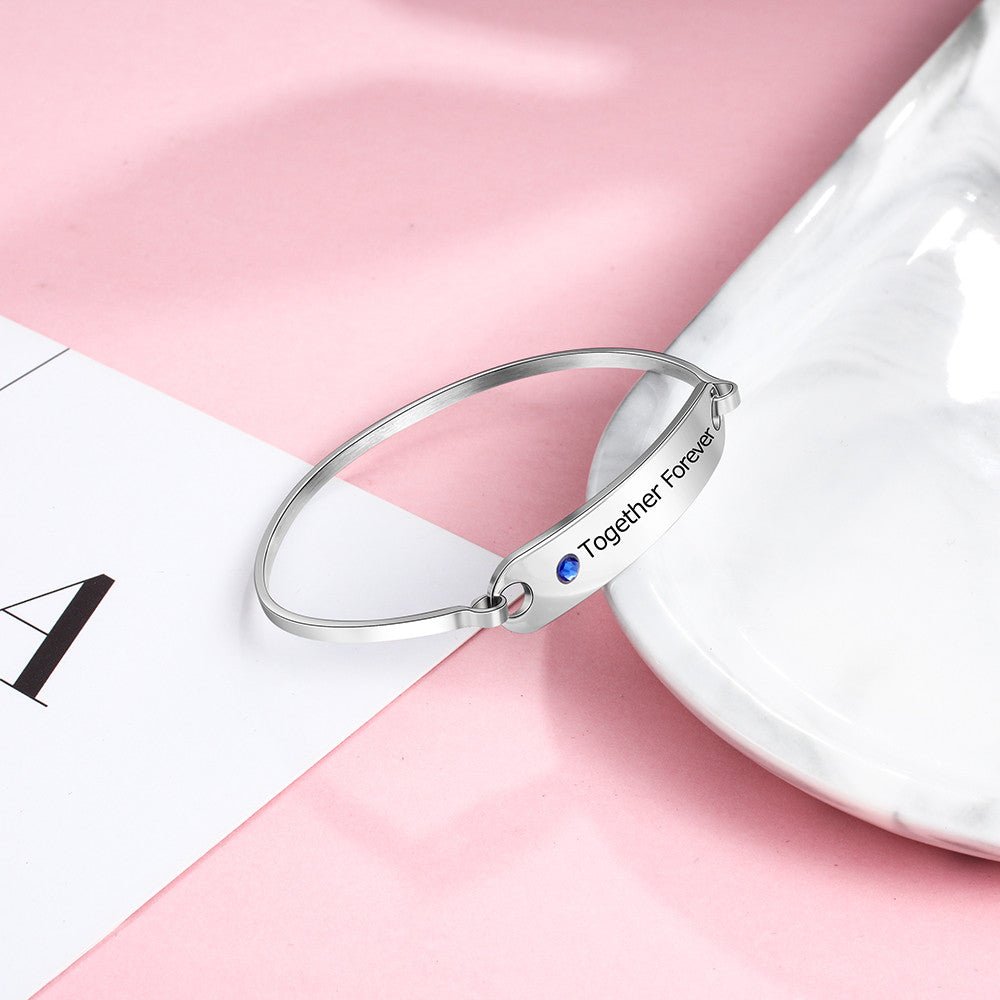 Personalized white gold plated birthstone bangle bracelet, engraved stainless steel, 17cm, 8.1g, perfect for gifting.