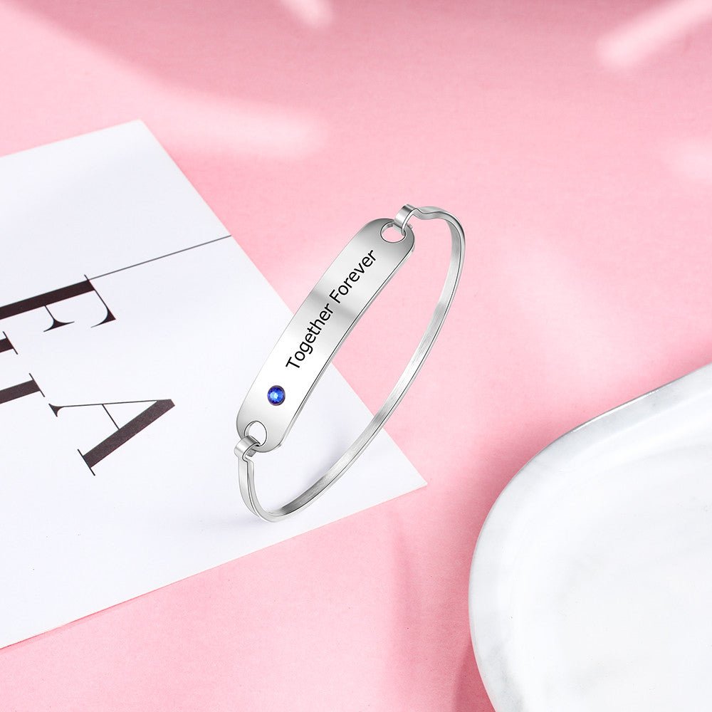 Personalized white gold plated birthstone bangle bracelet, engraved stainless steel, 17cm, 8.1g, perfect for gifting.