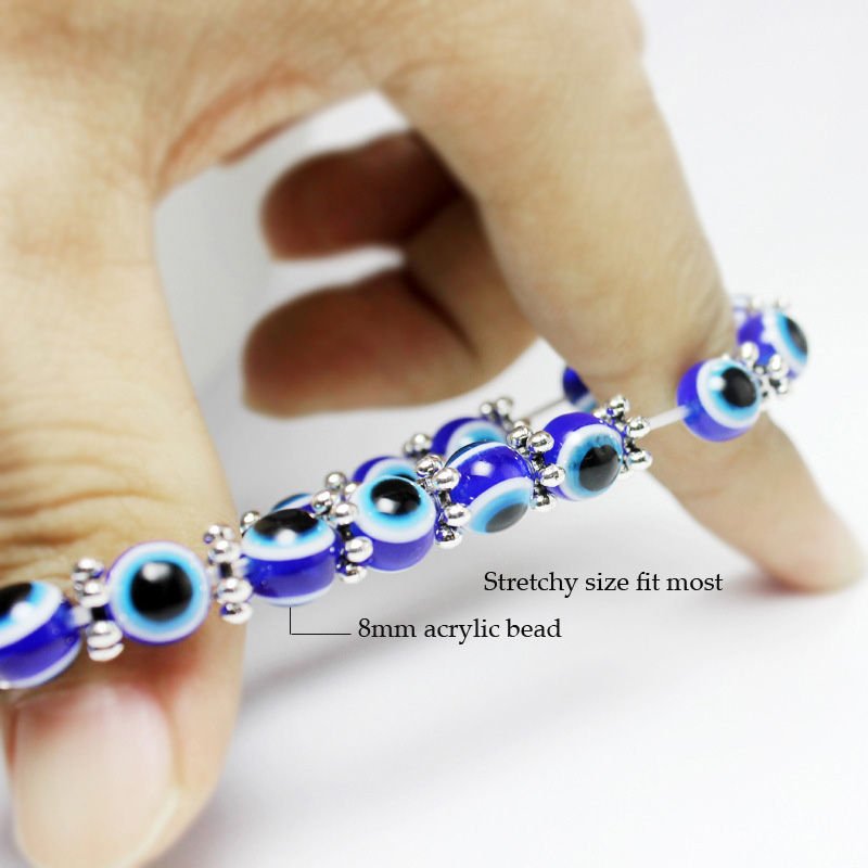 Chakra bead lava stone bracelet with evil eye charm, adjustable, spiritual protection, energy balancing.