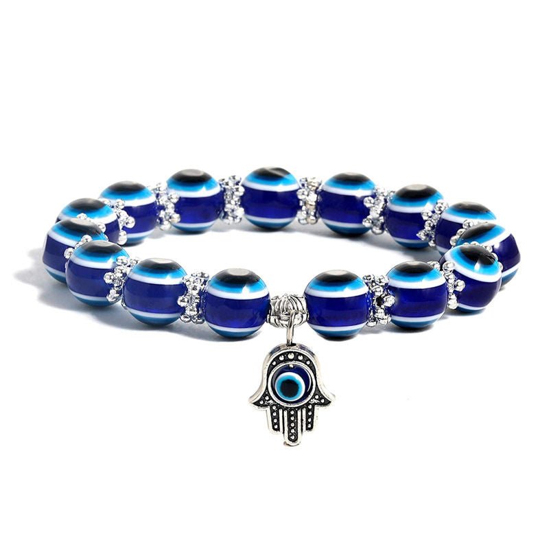 Chakra bead lava stone bracelet with evil eye charm, adjustable, spiritual protection, energy balancing.