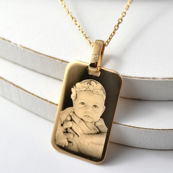 Engraved gold dog tags top