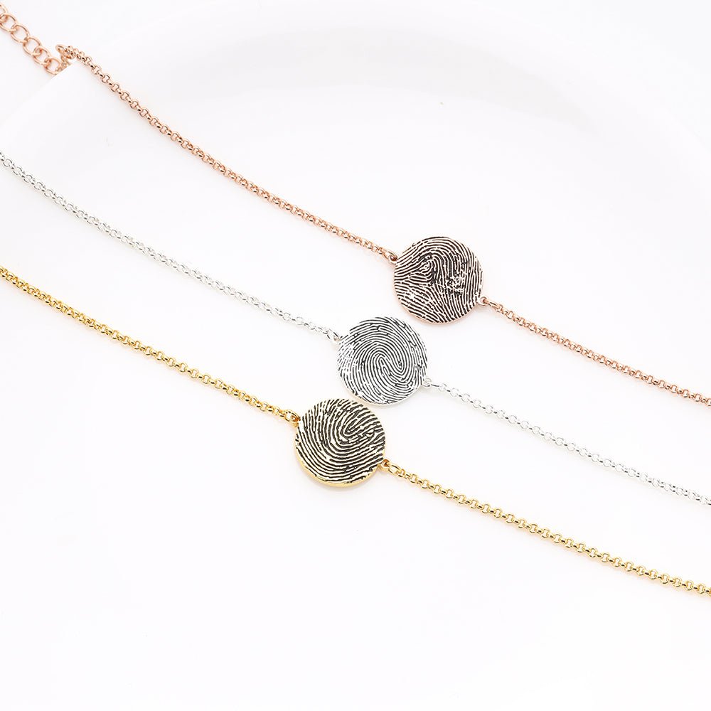 Personalized sterling silver fingerprint bracelet with heart or disc design, adjustable 18+5cm, 4g, available in white, gold, or rose gold plating.