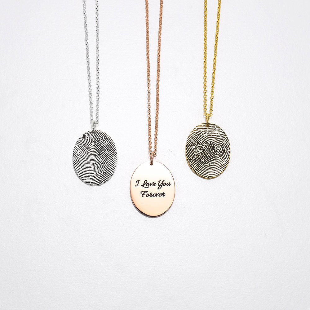 Custom sterling silver fingerprint necklace, round pendant, available in white, gold, or rose gold.