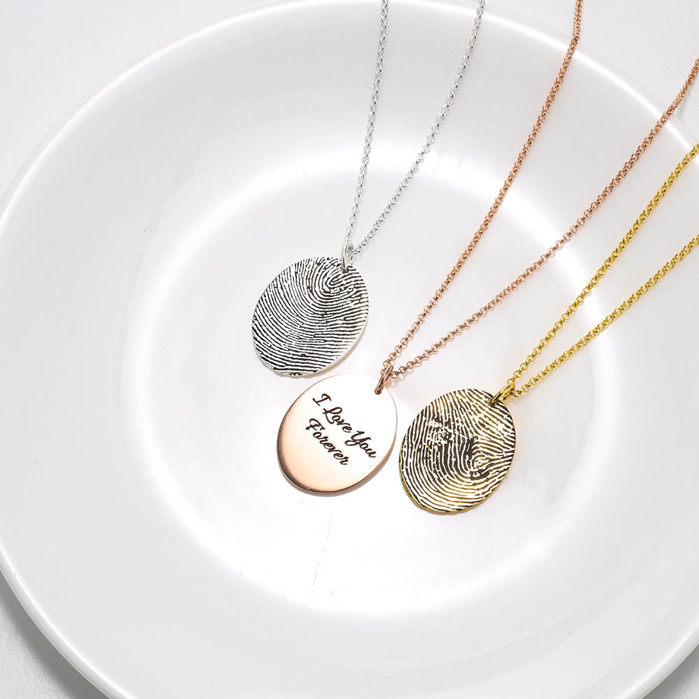 Custom sterling silver fingerprint necklace, round pendant, available in white, gold, or rose gold.