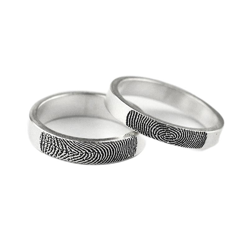 Personalized his & hers fingerprint rings in sterling silver, perfect for couples to cherish forever.