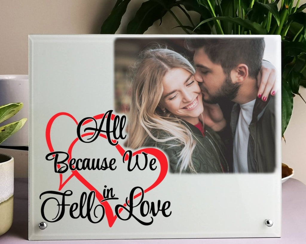 Personalized glass photo display with 'All Because We Fell in Love' text, perfect Valentine's gift.