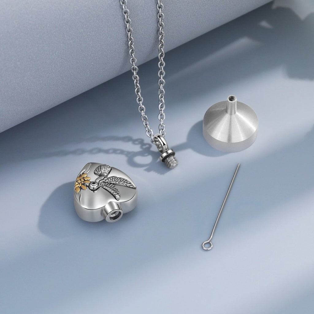Stainless steel heart cremation necklace with hummingbird design, 45cm chain, holds ashes, 17.7g.