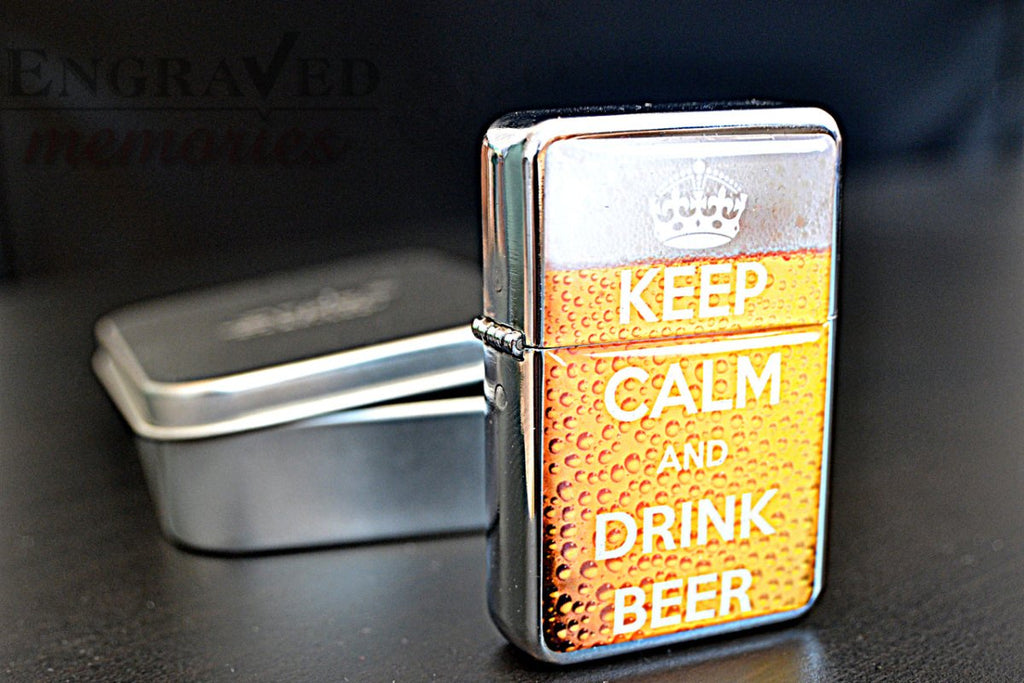 Engraved 'Keep Calm & Drink Beer' star petrol lighter with flint ignition, comes in a tin box.