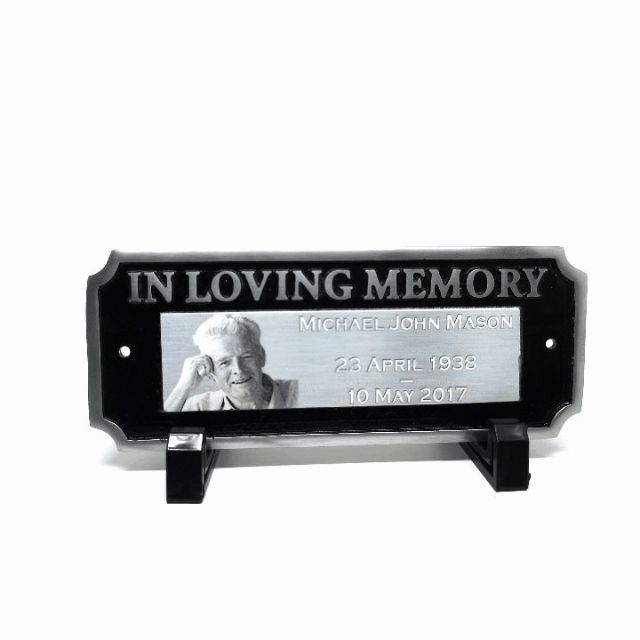 Elegant cast aluminum bench plaque with "In Loving Memory" and space for a personalized photo and text, perfect for remembrance.