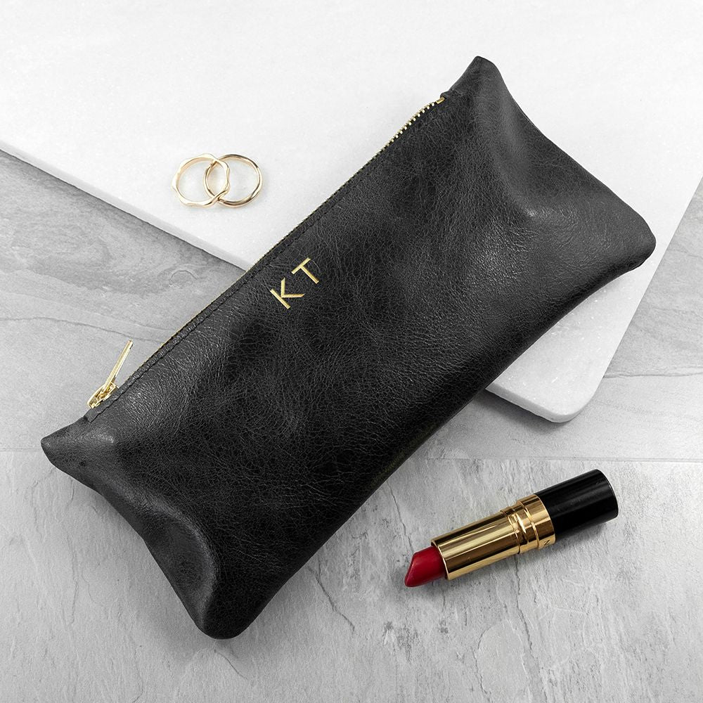Monogrammed black leather slimline clutch, handmade in the UK, personalized with up to 3 gold initials.