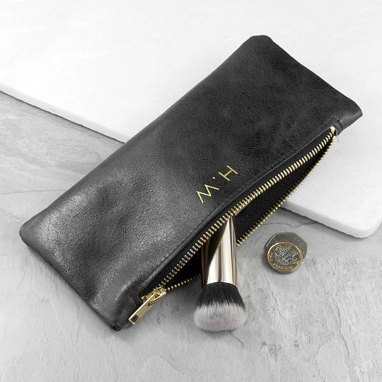Monogrammed black leather slimline clutch, handmade in the UK, personalized with up to 3 gold initials.
