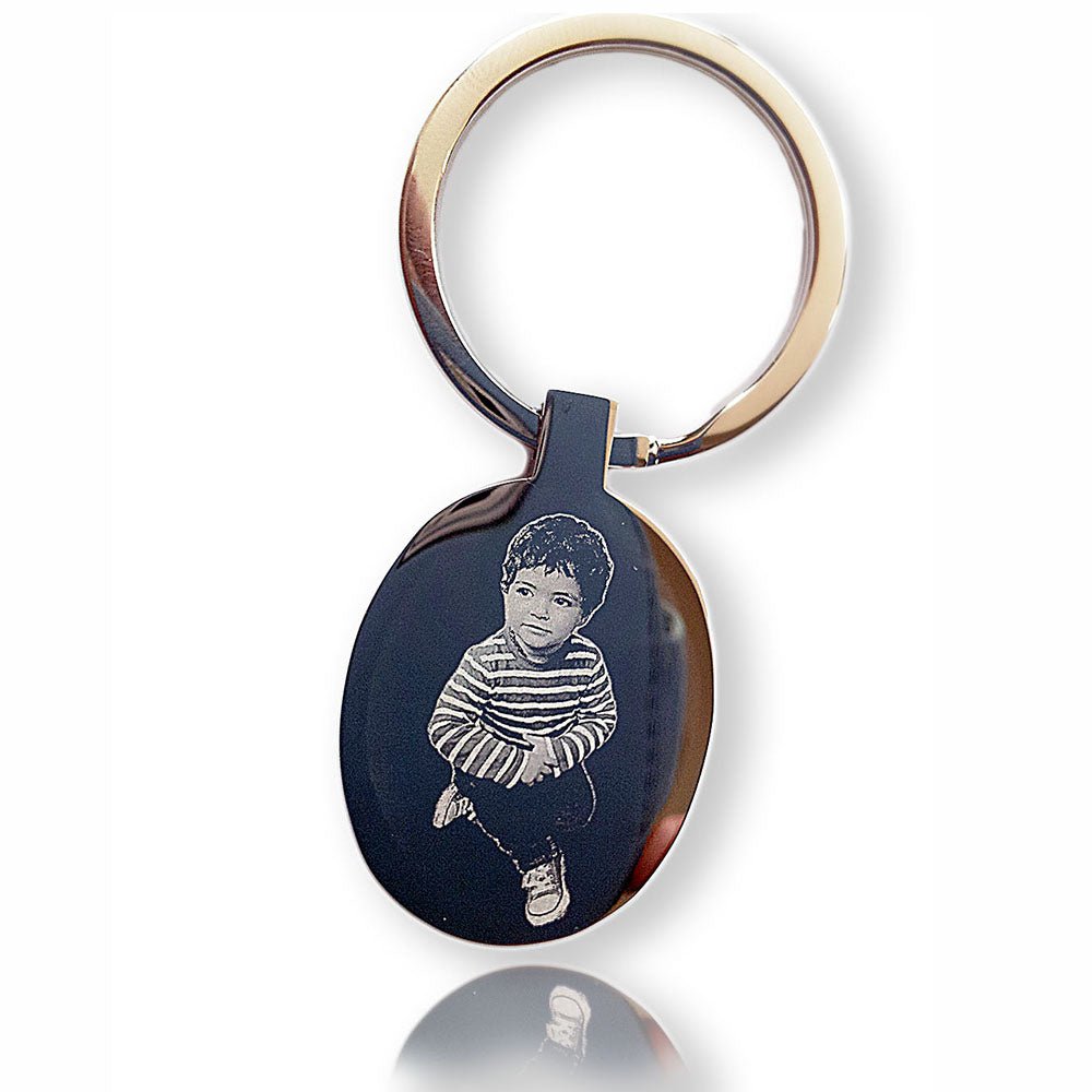 Engraved Oval Photo Keychain in mirror-finished stainless steel, customizable with photos, text, or logos.