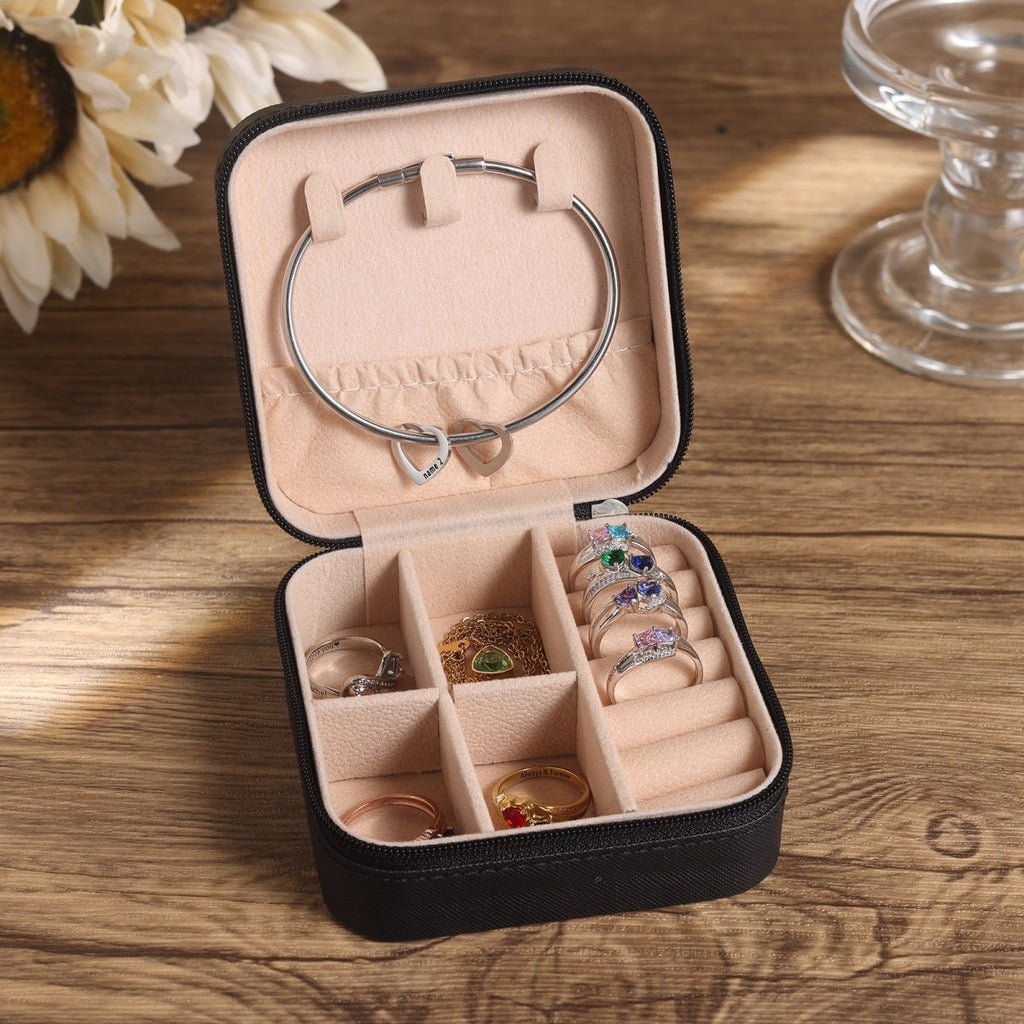 Personalised travel jewellery box, customizable with name & birth flower, in white, pink, or black.