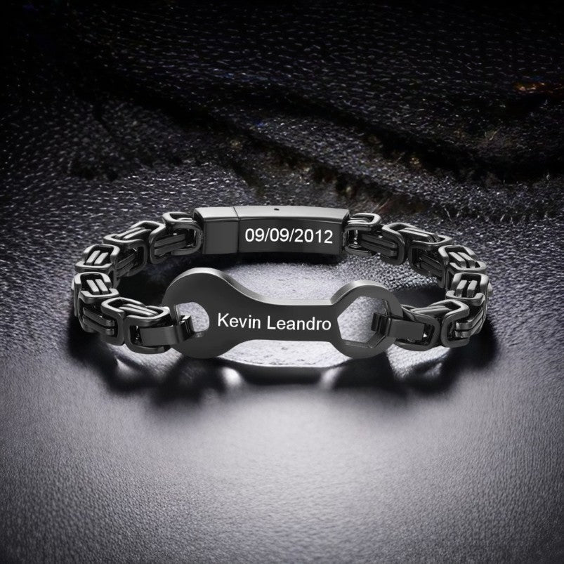 Personalised black stainless steel wrench bracelet (22cm), custom engraved with names & date— a perfect dad gift.