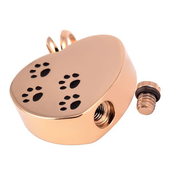 Gold-plated stainless steel heart-shaped cremation pendant with paw print design. 