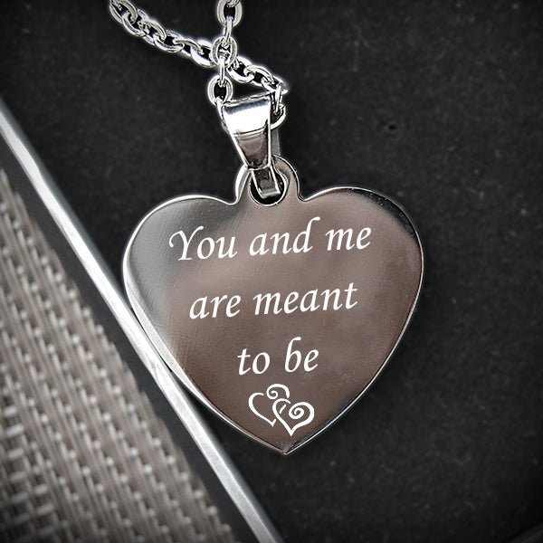 Personalized heart-shaped stainless steel photo necklace, engraved with custom text or image.