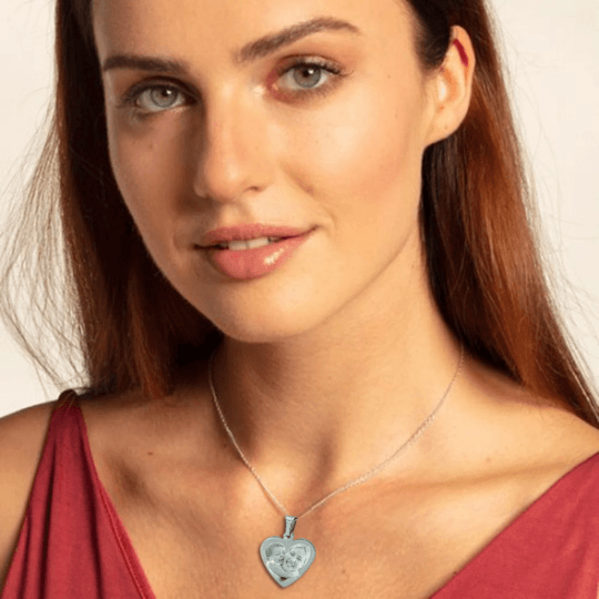 Personalized heart-shaped stainless steel photo necklace, engraved with custom text or image.