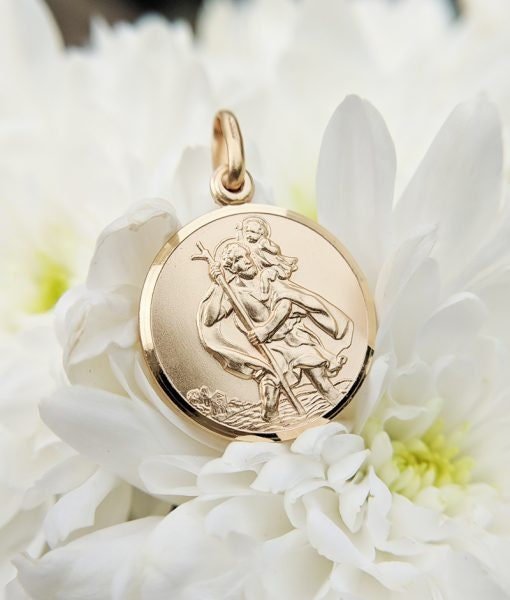 9ct Gold St. Christopher pendant featuring traditional safe travel image. Embossed design, measures 18mm in diameter.