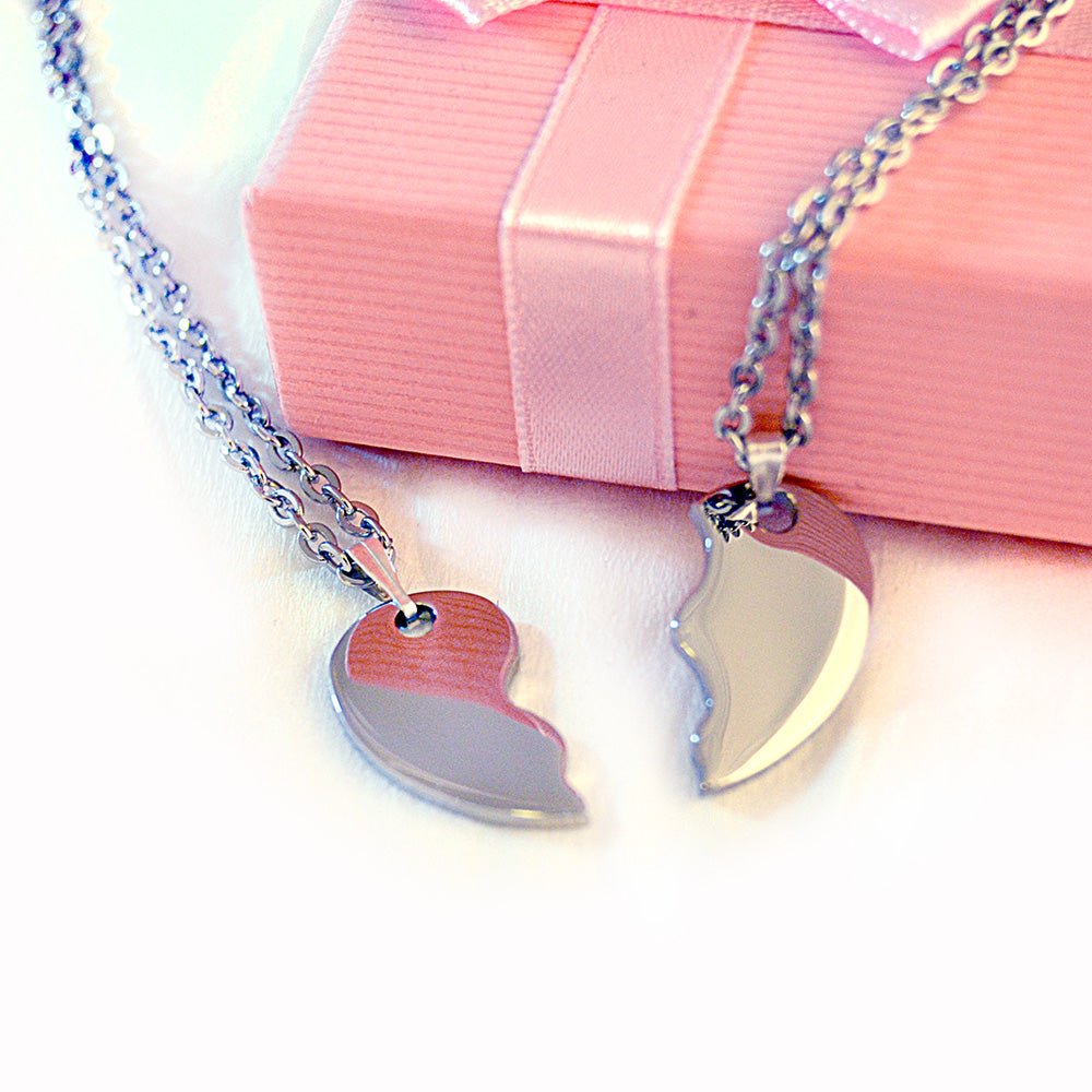 Personalized stainless steel split heart pendant necklace, 22-inch curb chain, engraved with names.