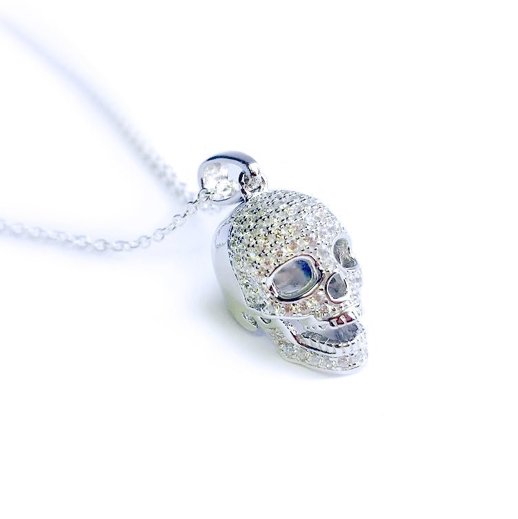 Sterling silver skull pendant necklace with CZ stones, Comes with a 20-inch chain and gift box.