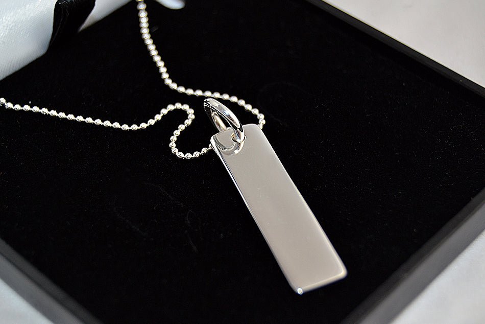 Customizable sterling silver bar pendant necklace, perfect for anyone. Engrave up to 30 characters on both sides.